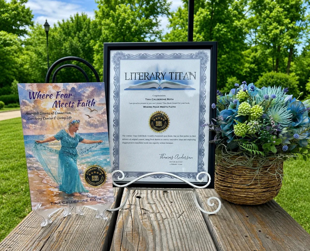 The framed Literary Titan Gold Book Award certificate beside the book and a basket of flowers.
